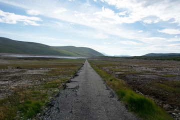 Looking eastwards at the bottom of Loch Glascarnoch and a road that is normally submerged and at the bottom of the loch