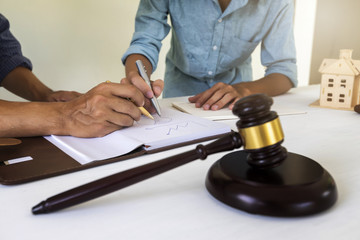 Judge gavel with lawyer bakground. Concepts of housing and real estate law.