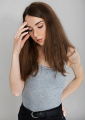 Teen woman suffering for headache or having depression.