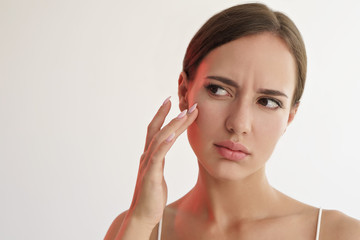 Fototapeta skin care concept. woman  unhappy with her skin obraz