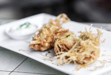 asian fried rice noodle shrimp spring rolls starter on plate