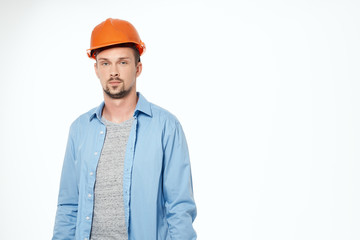 male builder in shirt and hard hat