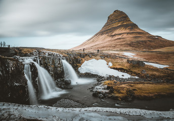 Kirkjufellsfoss and Kirkjufell Icelandic, Church mountain , a 463 m high mountain on the north coast of Iceland's Snaefellsnes peninsula, near the town of Grundarfjordur, Iceland