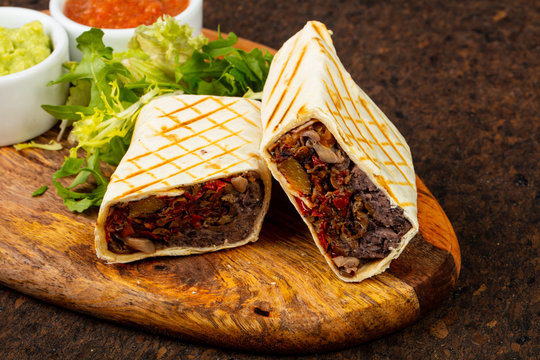 Delicious burito with sauce