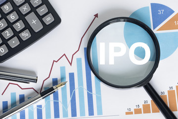 Businessman search button ipo Initial Public Offering magnifier graph loupe. - 215682102