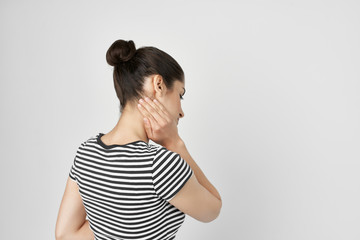Fototapeta premium a woman experiences pain in the neck