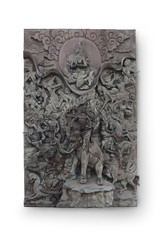 The demon army sent to tempt Gautama Buddha as he meditated under the Bodhi Tree. Thai style Teak wood carving at Wat Traimit (Thai Temple) Bangkok,Thailand