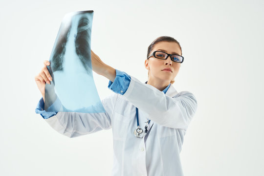 woman doctor holding an x-ray in her hand