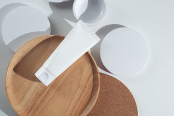 top view cosmetic cream facial mockup on wood dish and white background