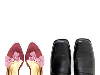 part of purple high heels shoes with pink ribbon bow and black leather shoes isolated on white background, couple standing side by side concept, flat lay close up top view with copy space for text