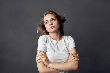 woman in white t-shirt thoughtful