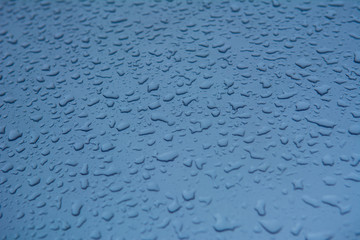 Rain drops on the car surface, Driving in rain,texture background.