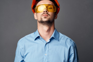 architect in a helmet with glasses portrait