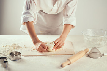 confectioner kneads dough