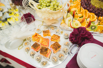 Different kinds of baked sweets on a buffet