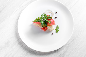 Watermelon salad with goat cheese and arugula