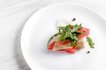 Watermelon salad with goat cheese and arugula