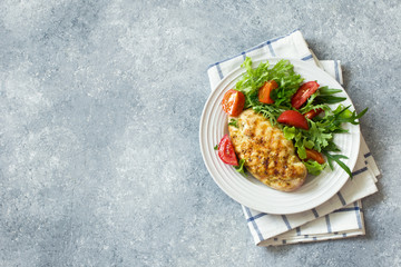 Grilled chicken breast and fresh vegetable salad