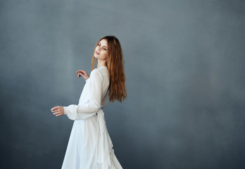 Fototapeta na wymiar woman in white dress dancing