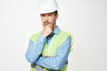 builder in a helmet on a light background