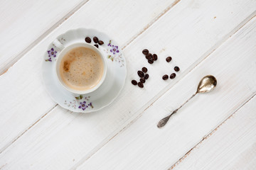 Cup of coffee and spoon.