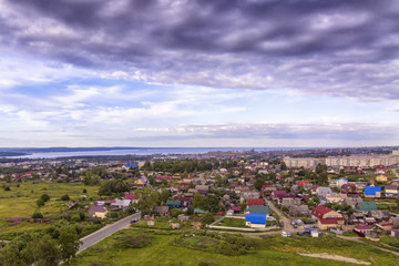 Aerial panorama of one-storied district of city outskirts