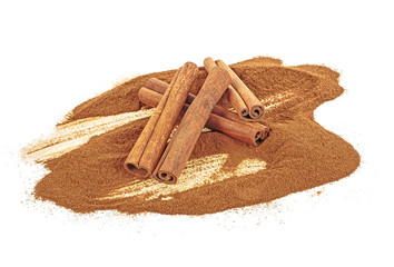 Cinnamon powder and sticks. White background.