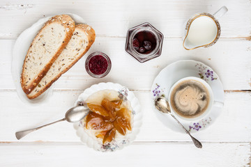 Breakfast with coffee on an old rural table.