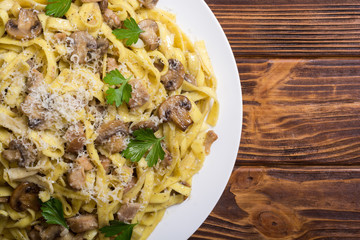 Pasta tagliatelle with chicken meat and mushroom
