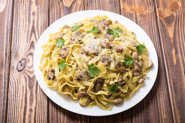 Pasta tagliatelle with chicken meat and mushroom