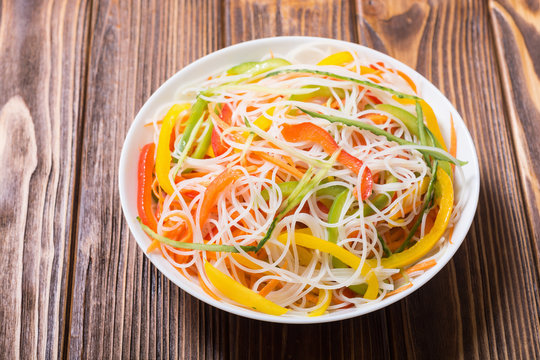 Salad from rice noodles with vegetables