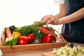 woman cutting vegetables in the kitchen