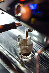 making espresso coffee close up detail with modern machine
