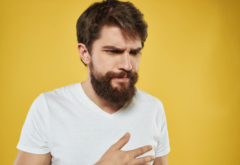 man with a beard on a yellow background