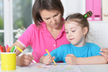 woman and  girl with colored pencils