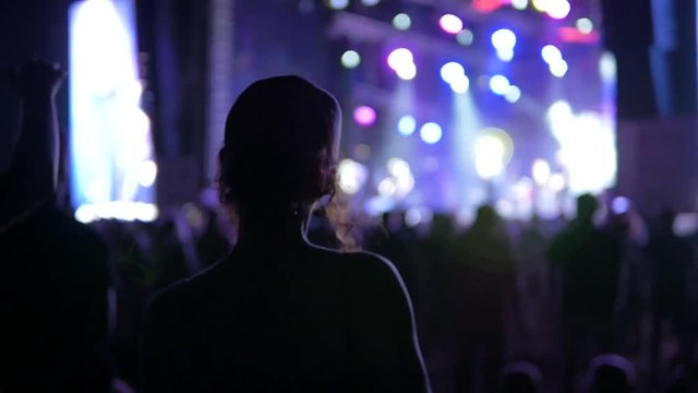 Girl dancing at a rock festival