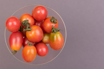 Cherry tomatoes on a colored background