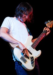 Obraz premium Closeup of a Musician Playing an Electric Bass