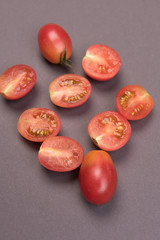 Cherry tomatoes on a colored background