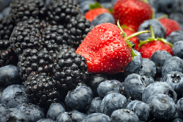 Closeup of strawberries, blackberries and blueberries.