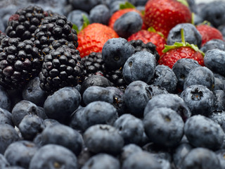 Closeup of strawberries, blackberries and blueberries.