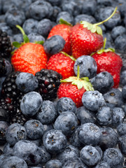 Closeup of strawberries, blackberries and blueberries.