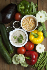 Health food with high fibre. Dieting, whole wheat cereals, grains, vegetables, antioxidants and vitamins: zzuchini, tomatoes, cucumbers, beans. Rustic wooden background top view.
