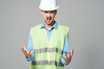 builder in a helmet holds his hands free space