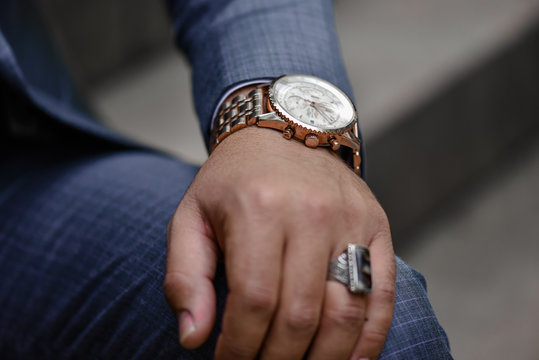 Wrist watch in a business suit. close up