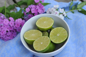 Limes in a Bowl with Blue Background