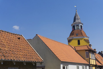 Historic tower and buildings in the town of Faaborg in Denmark