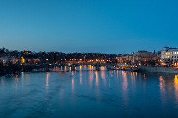 Fototapeta na wymiar River Vitava and old town of Prague by night