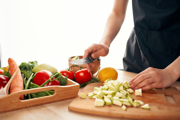 woman cutting vegetables in the kitchen