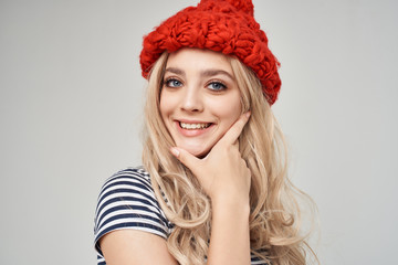 woman in red hat smiling